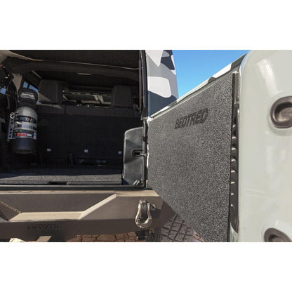 BedRug 2018-2026 Jeep Wrangler Tailgate Mat - Charcoal (BTJLTG) installed in a Jeep tailgate area.