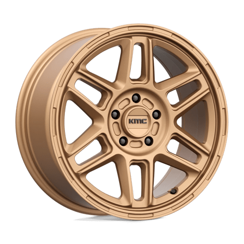 KMC KM716 NOMAD Matte Bronze wheel showcasing its rugged design and off-road performance capabilities.