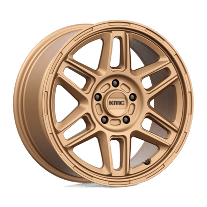 KMC KM716 NOMAD Matte Bronze wheel showcasing its rugged design and off-road performance capabilities.
