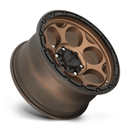 KMC KM541 DIRTY HARRY Matte Bronze W/ Black Lip wheel showcasing rugged design and bold aesthetics.