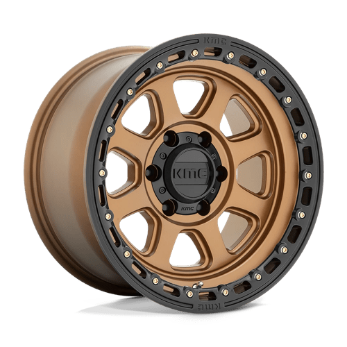 KMC KM548 CHASE Matte Bronze W/ Black Lip wheel showcasing aggressive design for off-road vehicles.