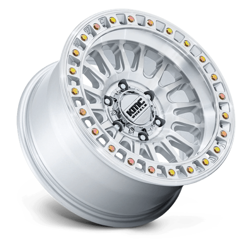 KMC KM552 IMS Gloss Silver W/ Machined Face wheel showcasing aggressive styling and off-road performance.