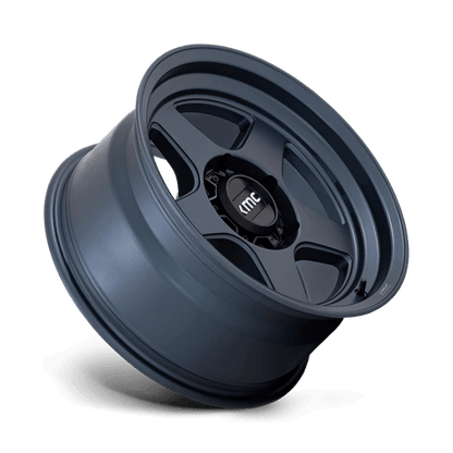 KMC KM728 LOBO Metallic Blue wheel showcasing rugged design and aggressive styling for off-road vehicles.