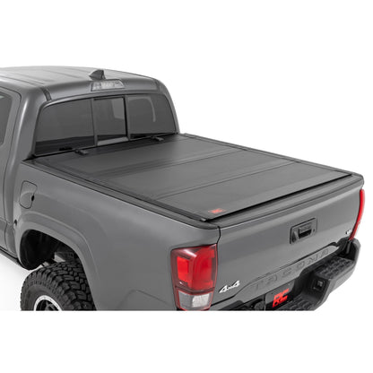 ROUGH COUNTRY Hard Tri-Fold Flip Up Bed Cover | 5' Bed | Toyota Tacoma 2WD/4WD (2005-2015) | 49415500