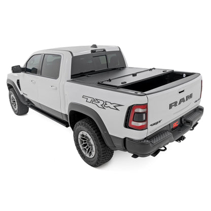 ROUGH COUNTRY Hard Tri-Fold Flip Up Fold Bed Cover | 5'7" Bed | Ram 1500 (19-25)/1500 TRX (21-24)  | 49320550
