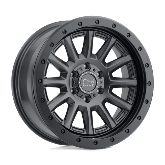 Black Rhino DUGGER Gun Black wheel showcasing a durable 12-spoke design with a rock guard for off-road protection.