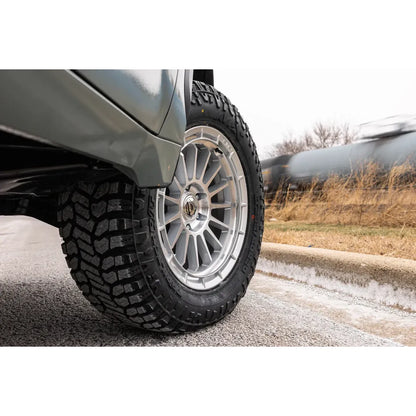 Close-up of AVIX Trailtek R/T Tires on a vehicle, showcasing rugged tread design for off-road and pavement use.