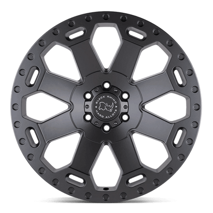 Black Rhino WARLORD Matte Gunmetal wheel with an 8-spoke design and green accents.